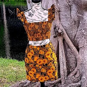 Two piece, top with the skirt.,yellow and black,